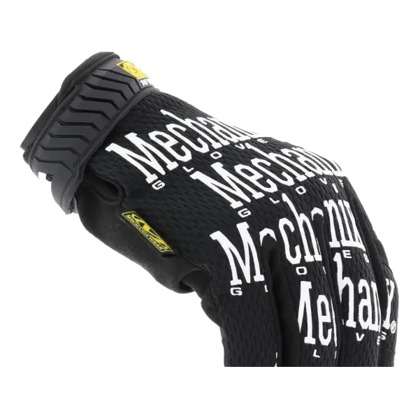 Black work glove with white ’Mechanix’ branding repeated across its surface.