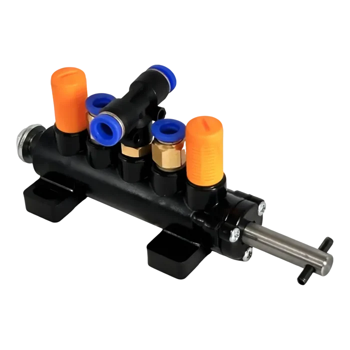 Pneumatic manifold with multiple ports and a control lever.