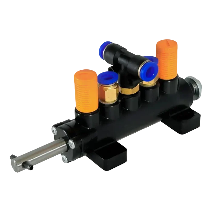 Pneumatic manifold with multiple ports and a central actuator.