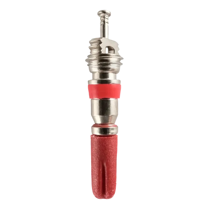 Tire valve stem with a red protective cap.
