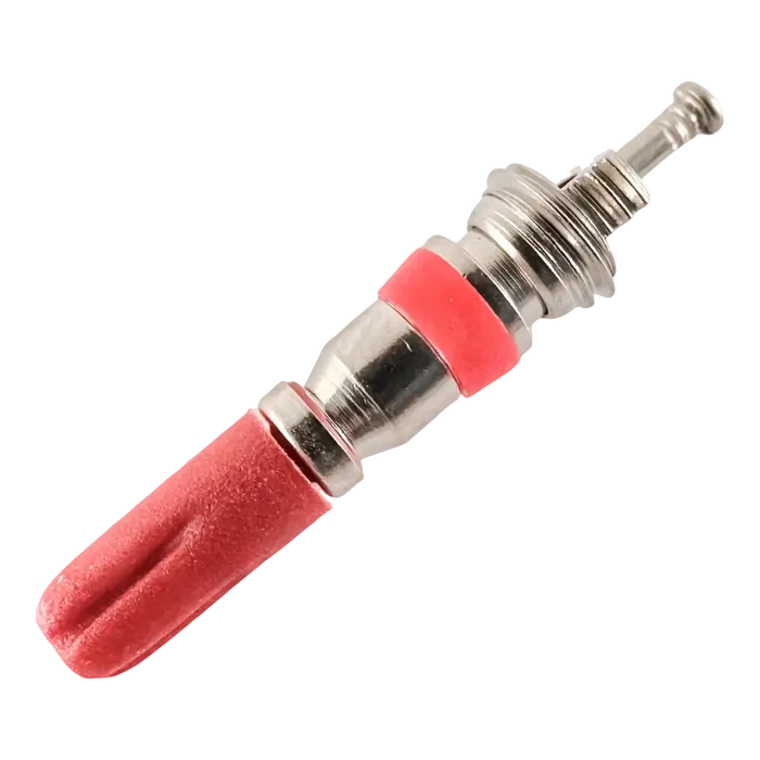 Spark plug with a red insulator and metal components.