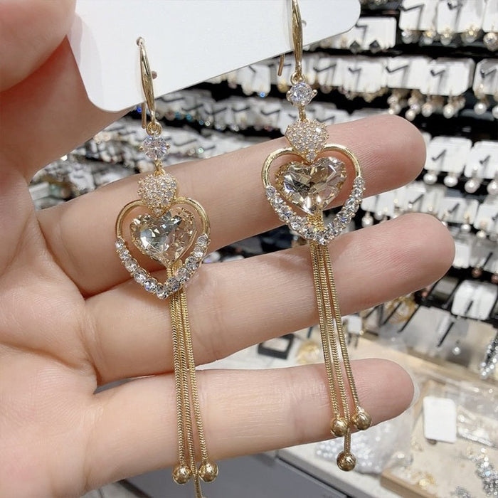 ✨ Elegantes pendientes con borlas en forma de corazón-ES
