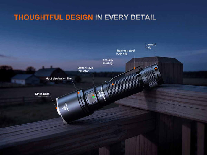 The Fenix C7 Pro on a wooden surface with labeled features against a dusk sky