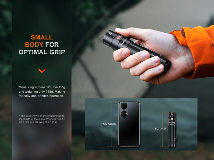 Hand holding Fenix E35R Rechargeable EDC Flashlight small size with size comparison to a cell phone