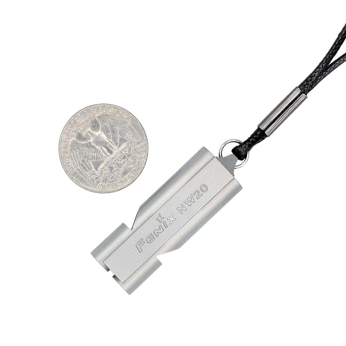 Fenix NW20 next to a coin to show size on a white background