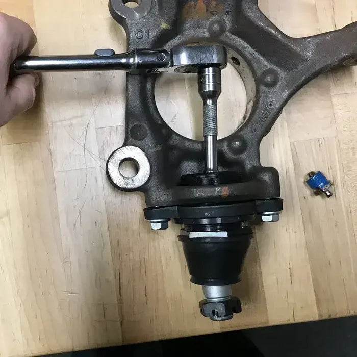 Automotive ball joint being pressed on the Northstar Front Lower Camber Adjustable Ball Joint for Ford Transit