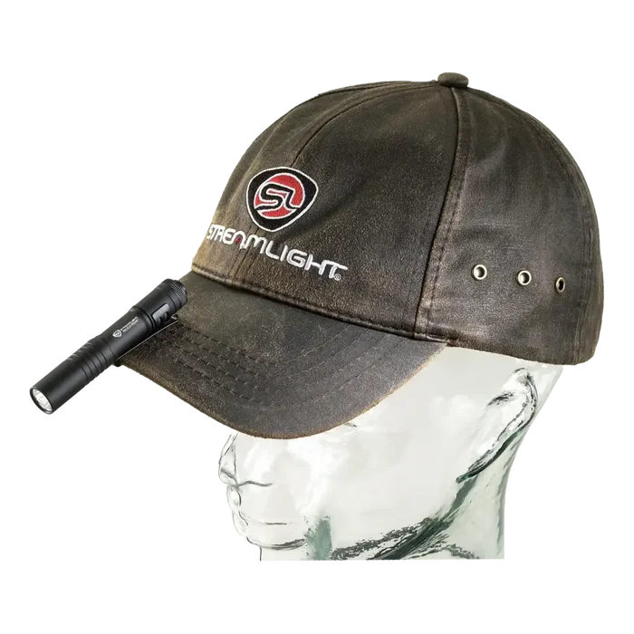 Brown baseball cap with Streamlight logo and flashlight for a compact pocket light