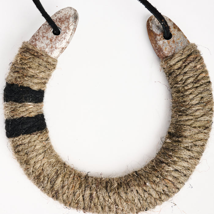 Upcycled Lucky Horseshoe in Neutral Stripes on a white background at Addison West