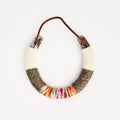 Upcycled Lucky Horseshoe in Rainbow on a white background at Addison West